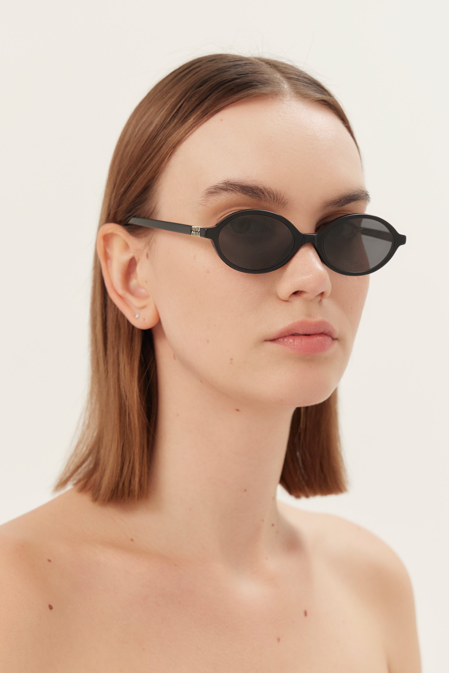 Miu Miu oval acetate black sunglasses