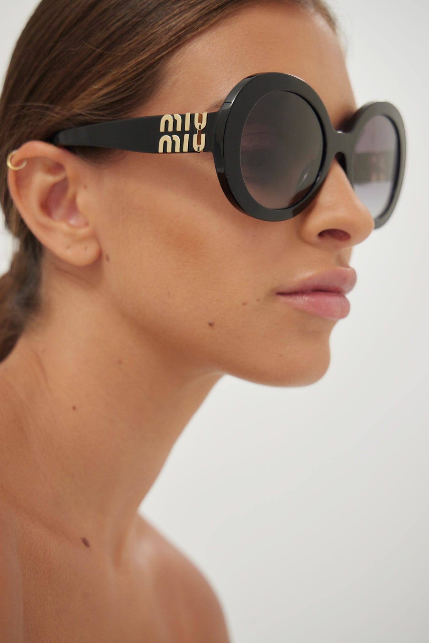 Miu Miu round black sunglasses - Eyewear Club