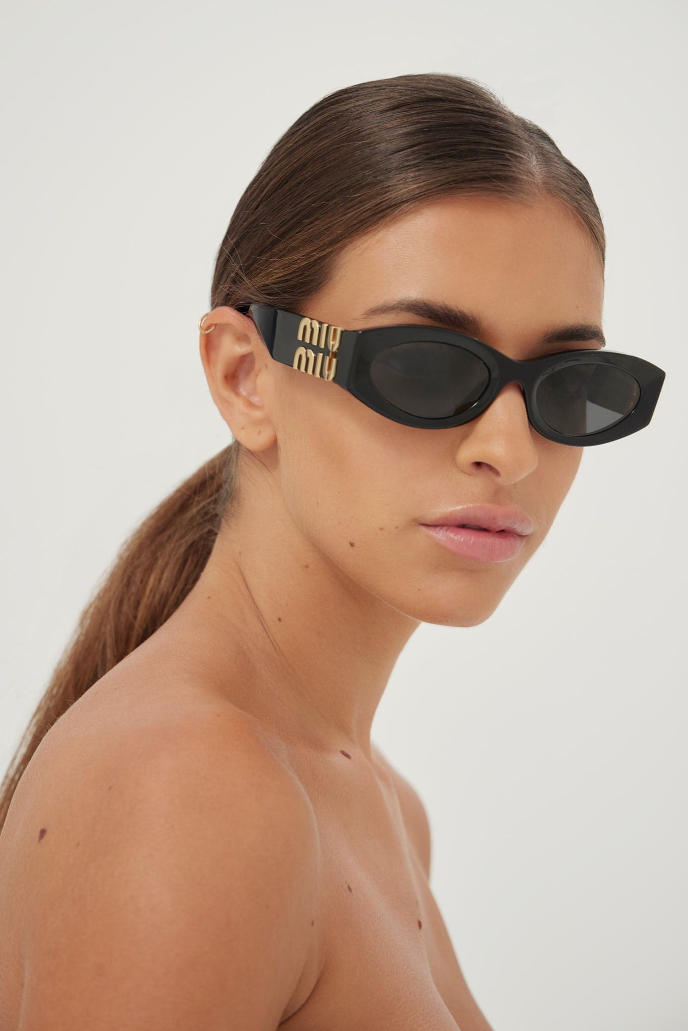 Miu Miu small oval black sunglasses - Eyewear Club