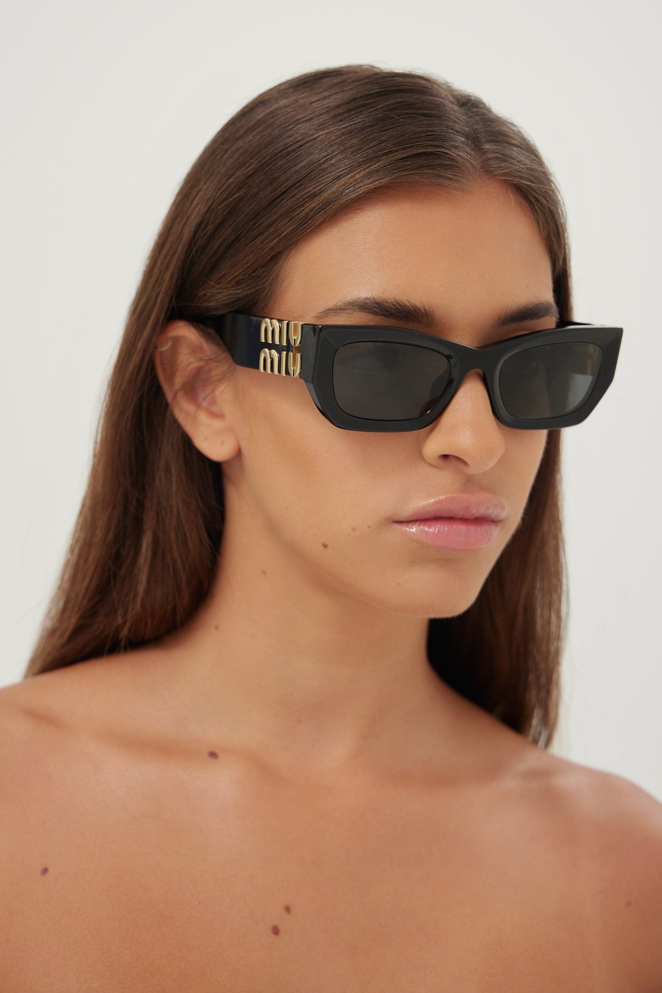 Miu Miu small cat-eye black sunglasses - Eyewear Club