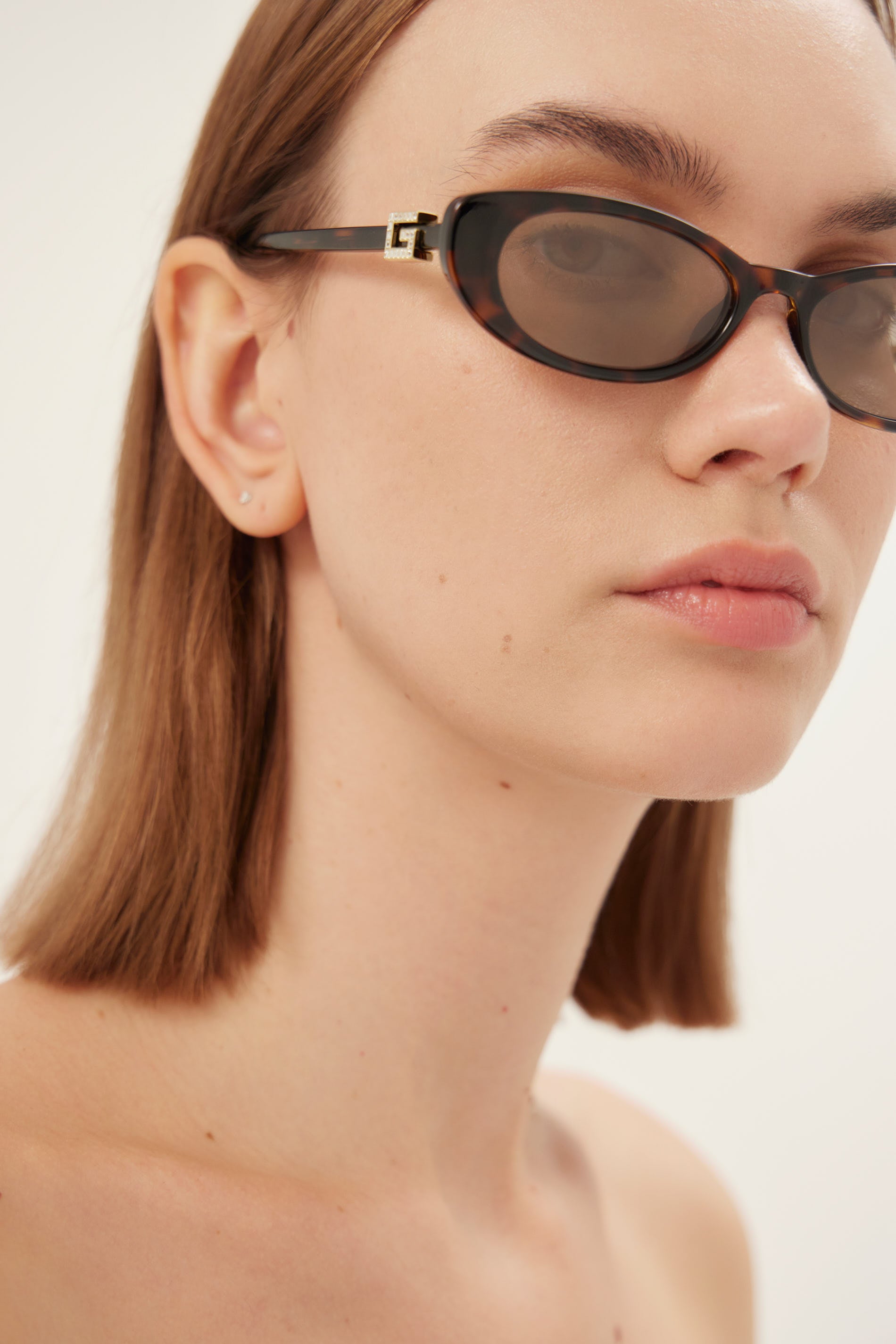 PRE ORDER - Oval cat-eye brown and grey Gucci sunglasses with gold logo