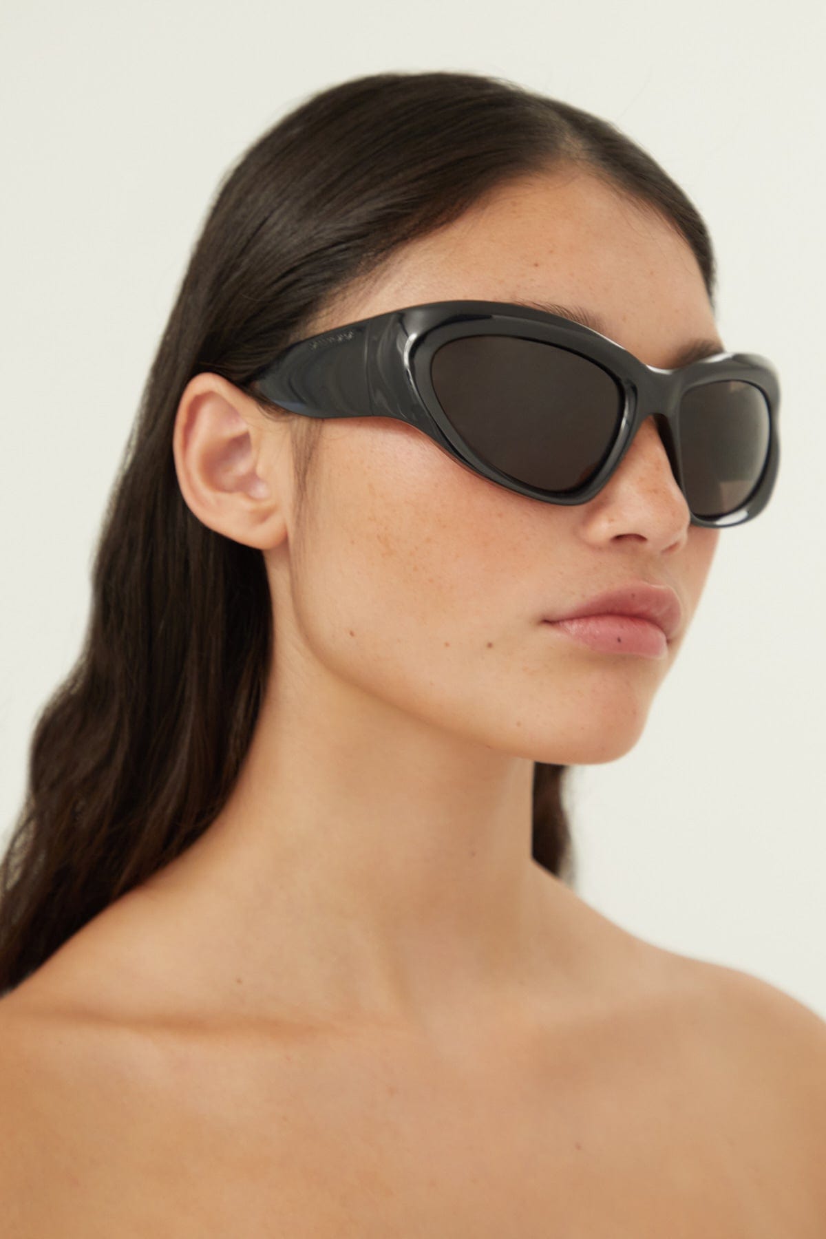 Balenciaga bold wrap around black sunglasses - Eyewear Club